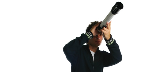 Man looking through telescope