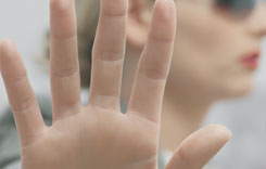 A person holding their hand in front of the camera