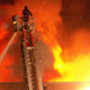 Firefighter on Ladder Over Fire