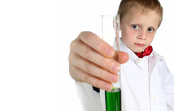 Boy Holding a Test tube With a Green liquid inside