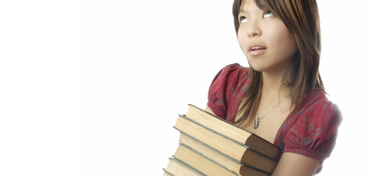 A lady with a stack of books