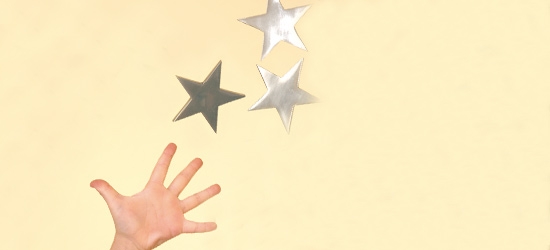 Hand reaching for stars
