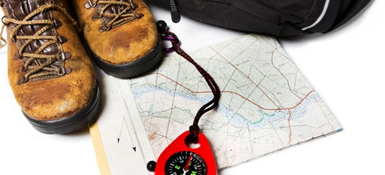 Walking boots, map and compass